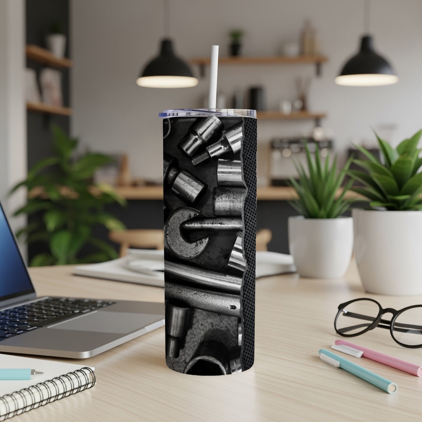 Tumbler featuring a close-up design of various metal tools and socket wrenches.
