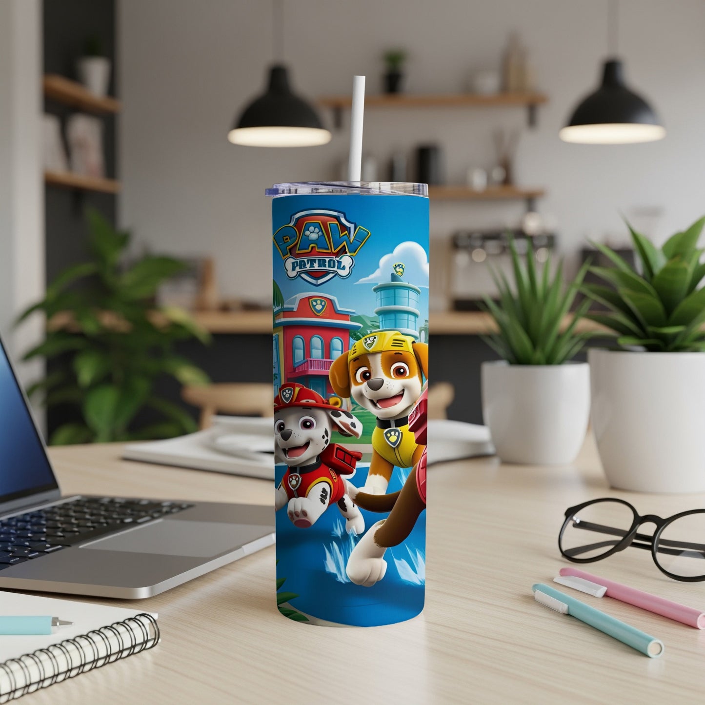 Paw Patrol characters Chase and Marshall on a blue tumbler with straw.