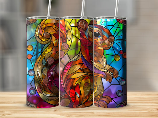 Stained glass squirrel tumbler with colorful mosaic patterns.