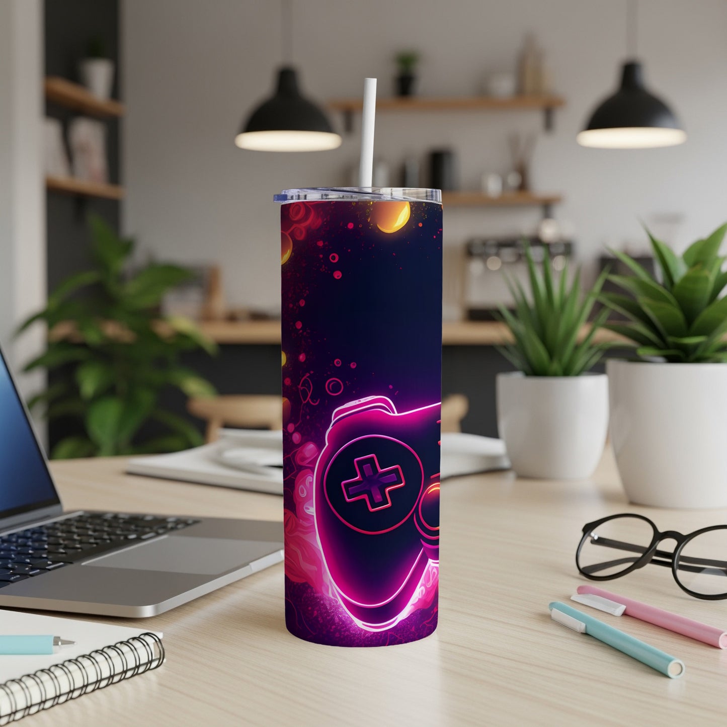 Neon pink and purple gaming controller design on a dark tumbler.