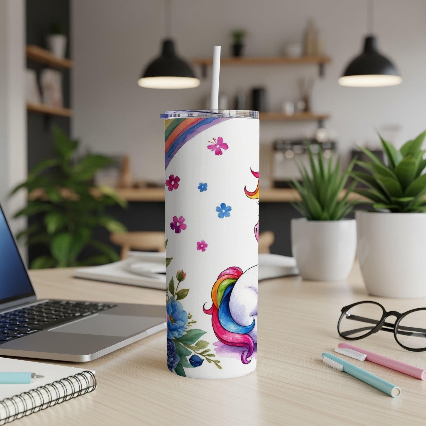 White tumbler with unicorn and floral design, straw.