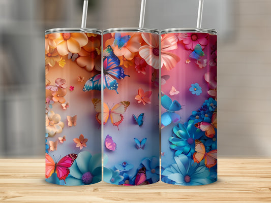 Three tumblers with colorful butterfly and flower designs.