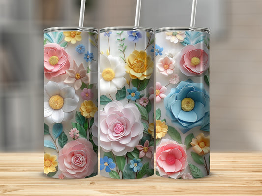 Three tumblers with floral designs, featuring pink, yellow, and blue flowers.