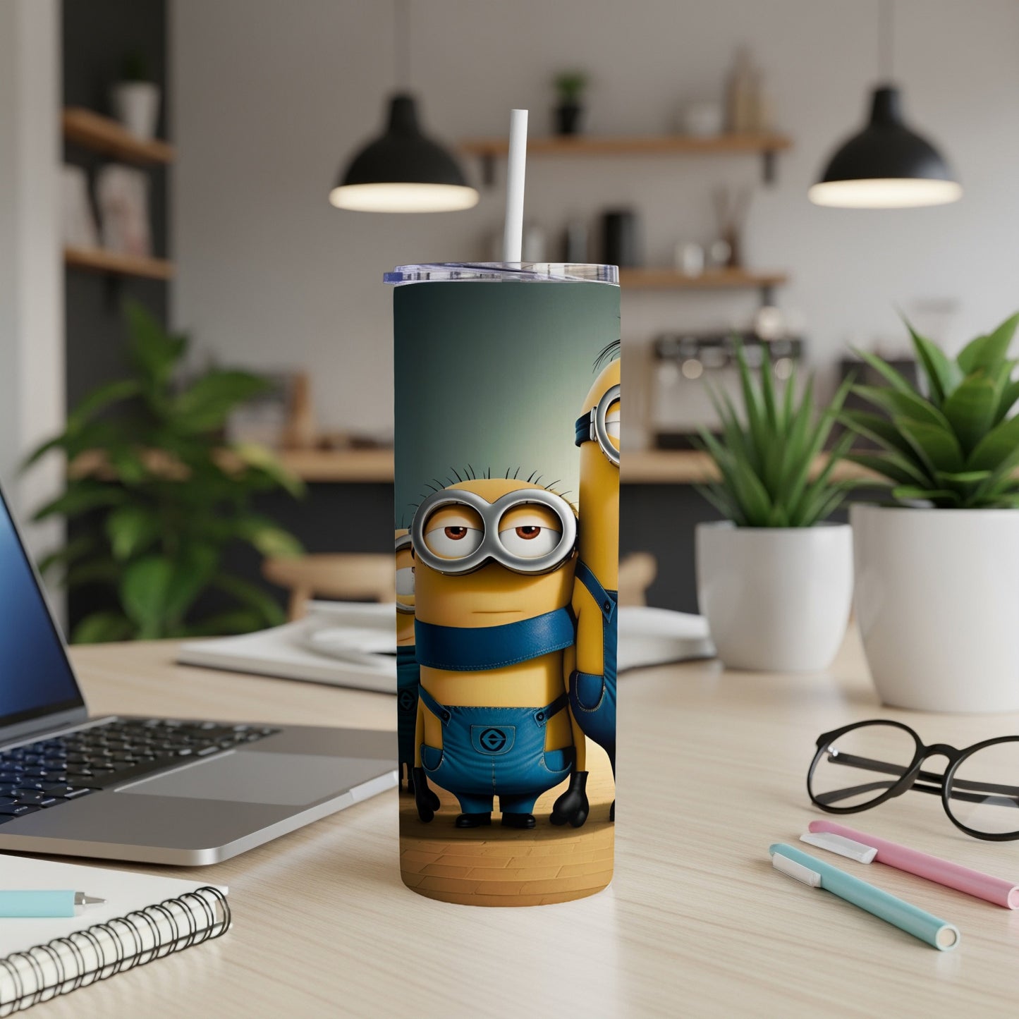 Minions Stuart and Dave on a blue and yellow tumbler with a straw.