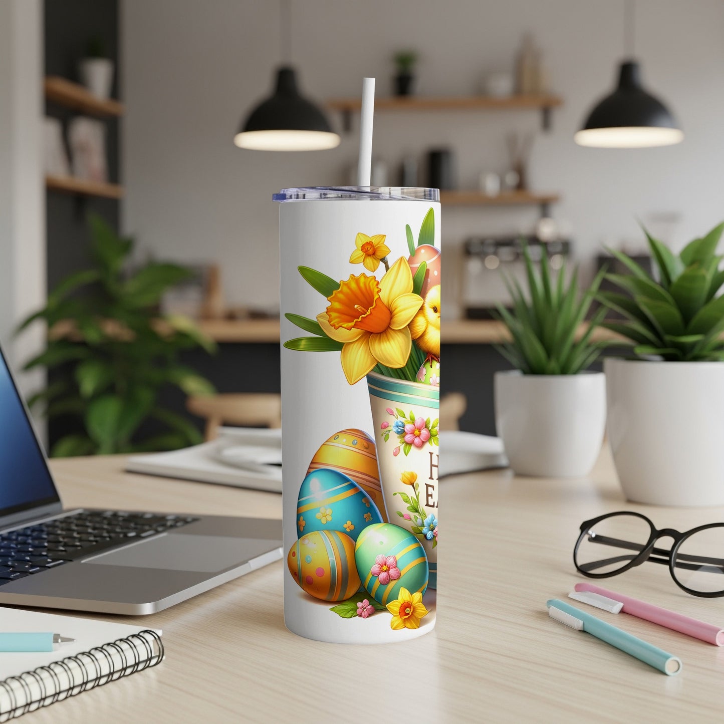 Easter tumbler with eggs, daffodils, and daisies in a patterned holder.