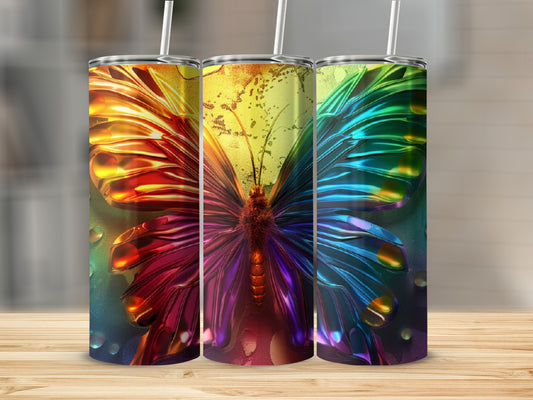 Three tumblers featuring a colorful, metallic butterfly design.