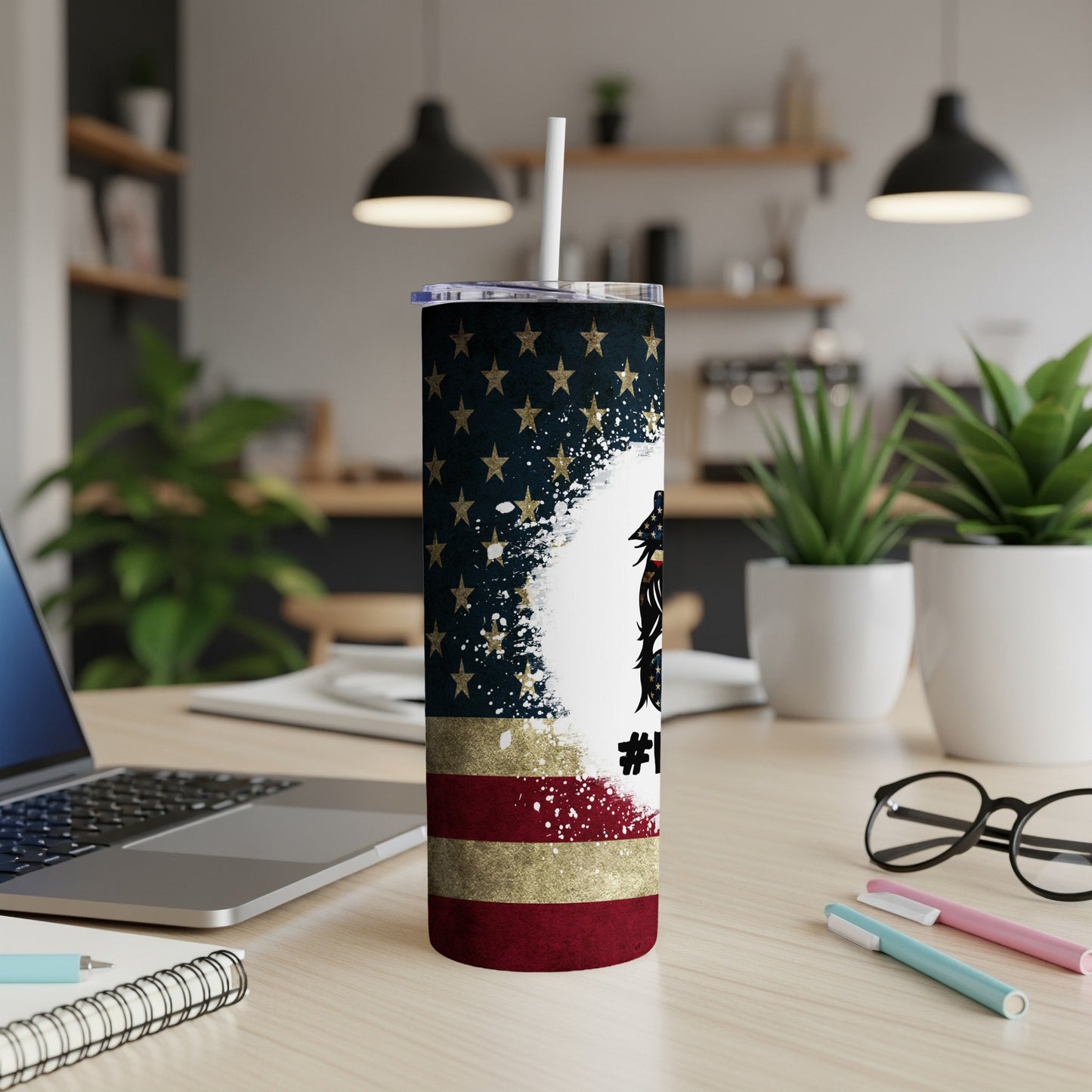 Tumbler with American flag pattern, stars, and gold glitter accents.