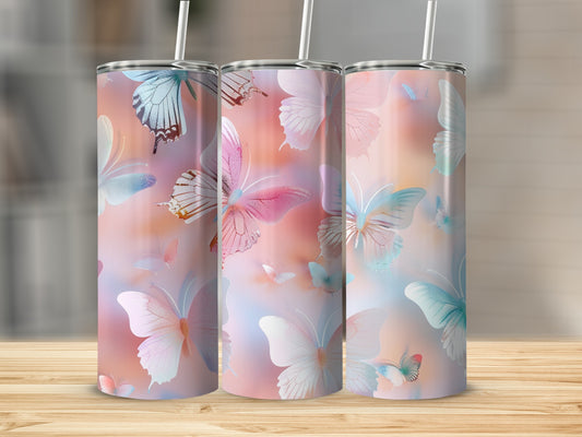 Three tumblers with a watercolor butterfly design in pastel pink and blue.