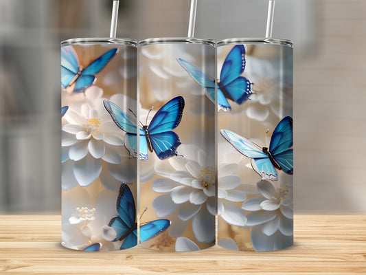 Three tumblers with blue butterflies and white flowers design.