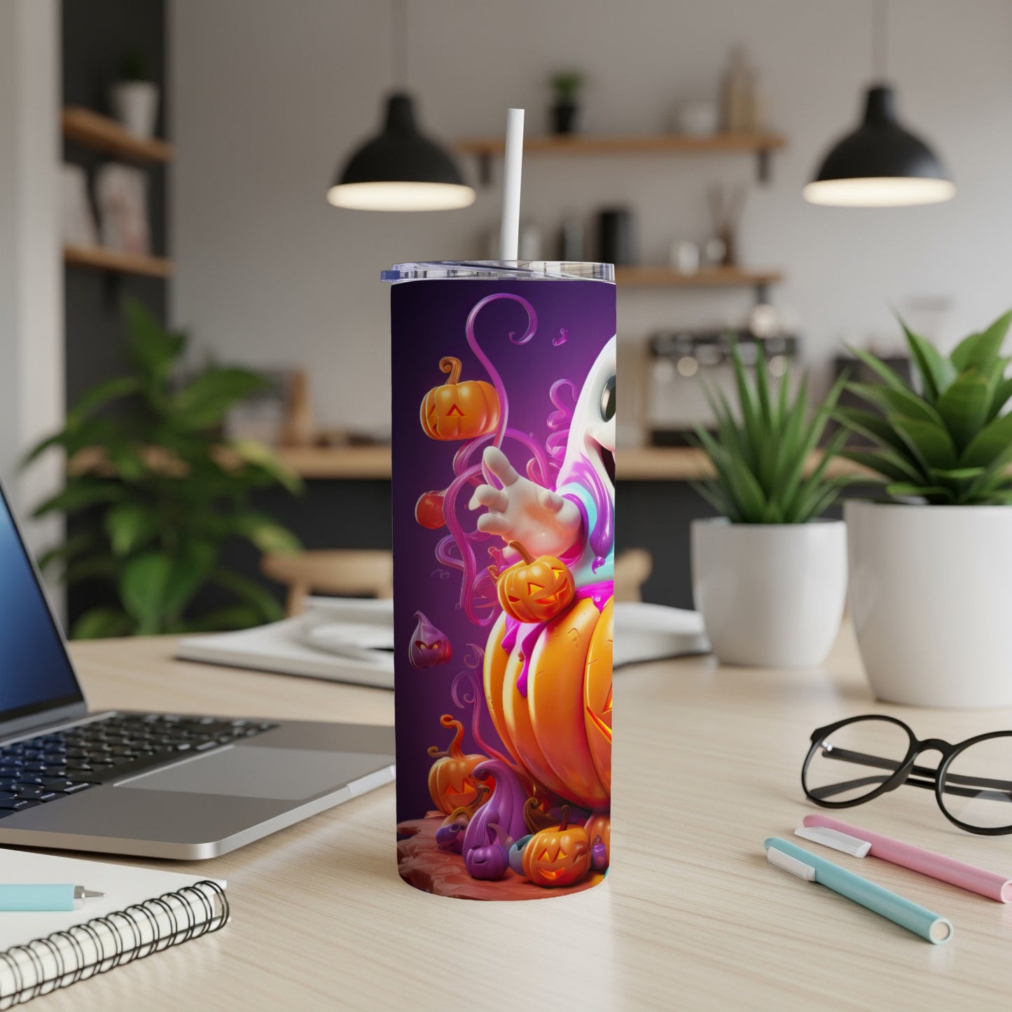 Purple tumbler with ghost and pumpkins Halloween design, featuring a white straw.