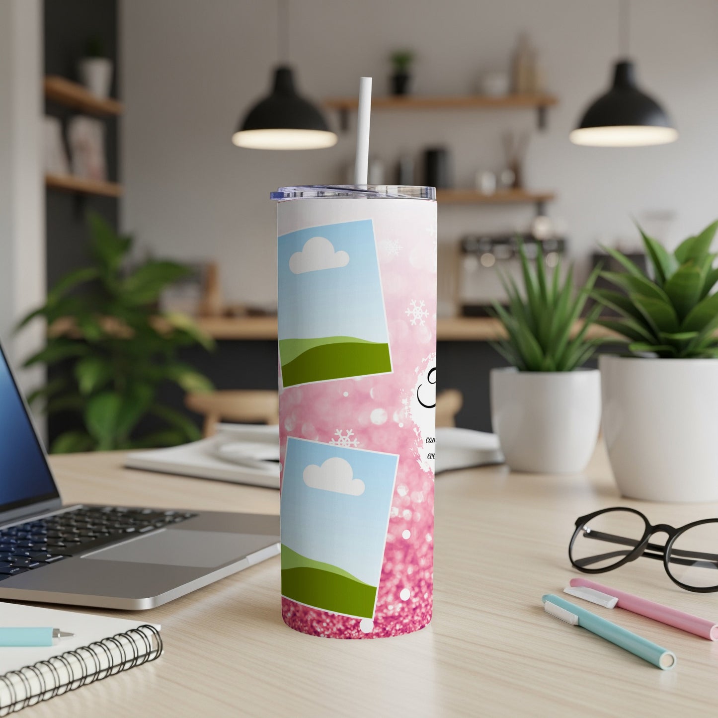 Pink glitter tumbler with photo placeholders and white snowflakes on a desk.