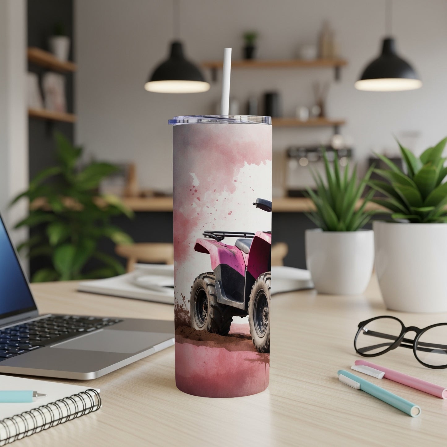 Pink ATV on a watercolor background, on a desk with a laptop.