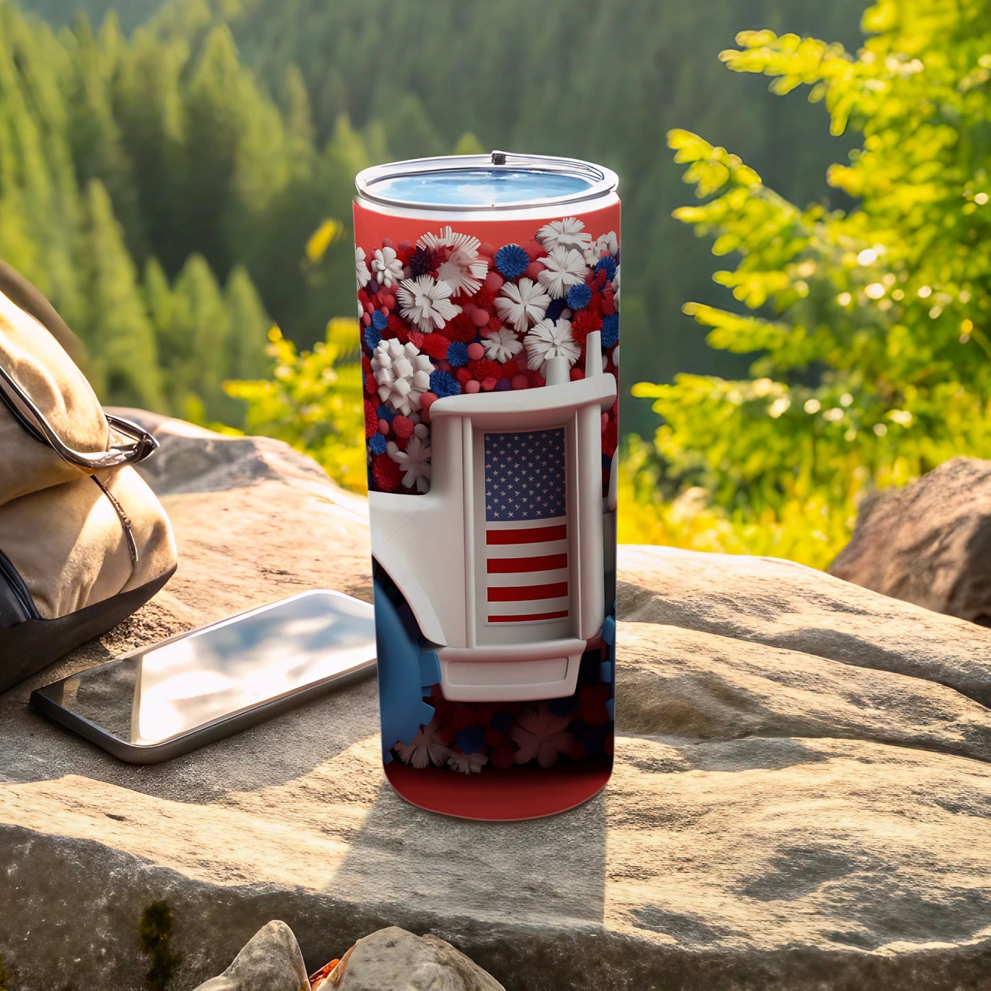 White tumbler with American flag, floral pattern, and outdoor background.
