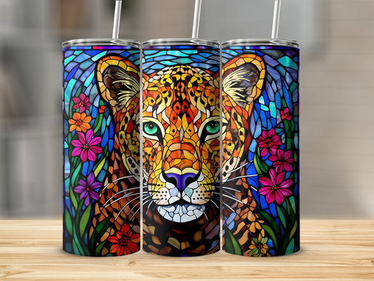 Stained glass leopard face surrounded by colorful flowers on three tumblers.