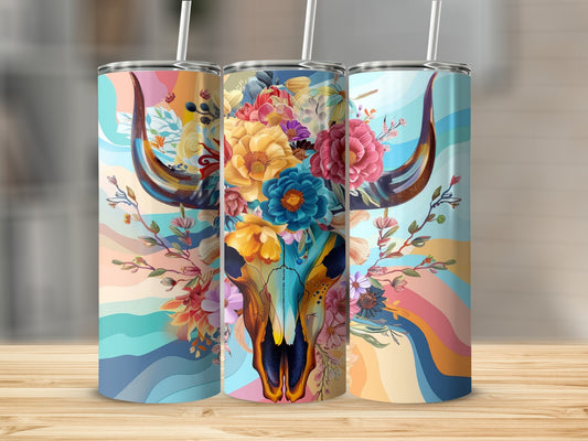 Bull skull adorned with colorful flowers against a wavy background.