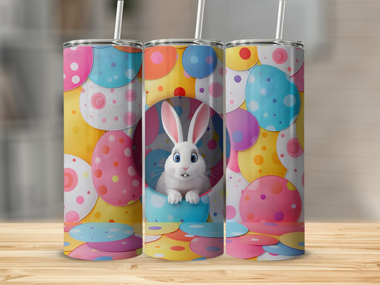 Easter bunny in colorful polka dot eggs, on a tumbler.