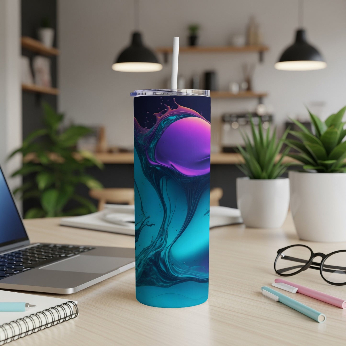 Tumbler with vibrant swirling purple and teal liquid design on a desk.
