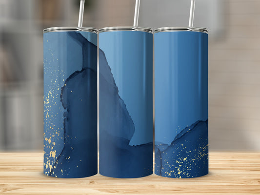Three blue and gold abstract pattern tumblers on a wooden surface.