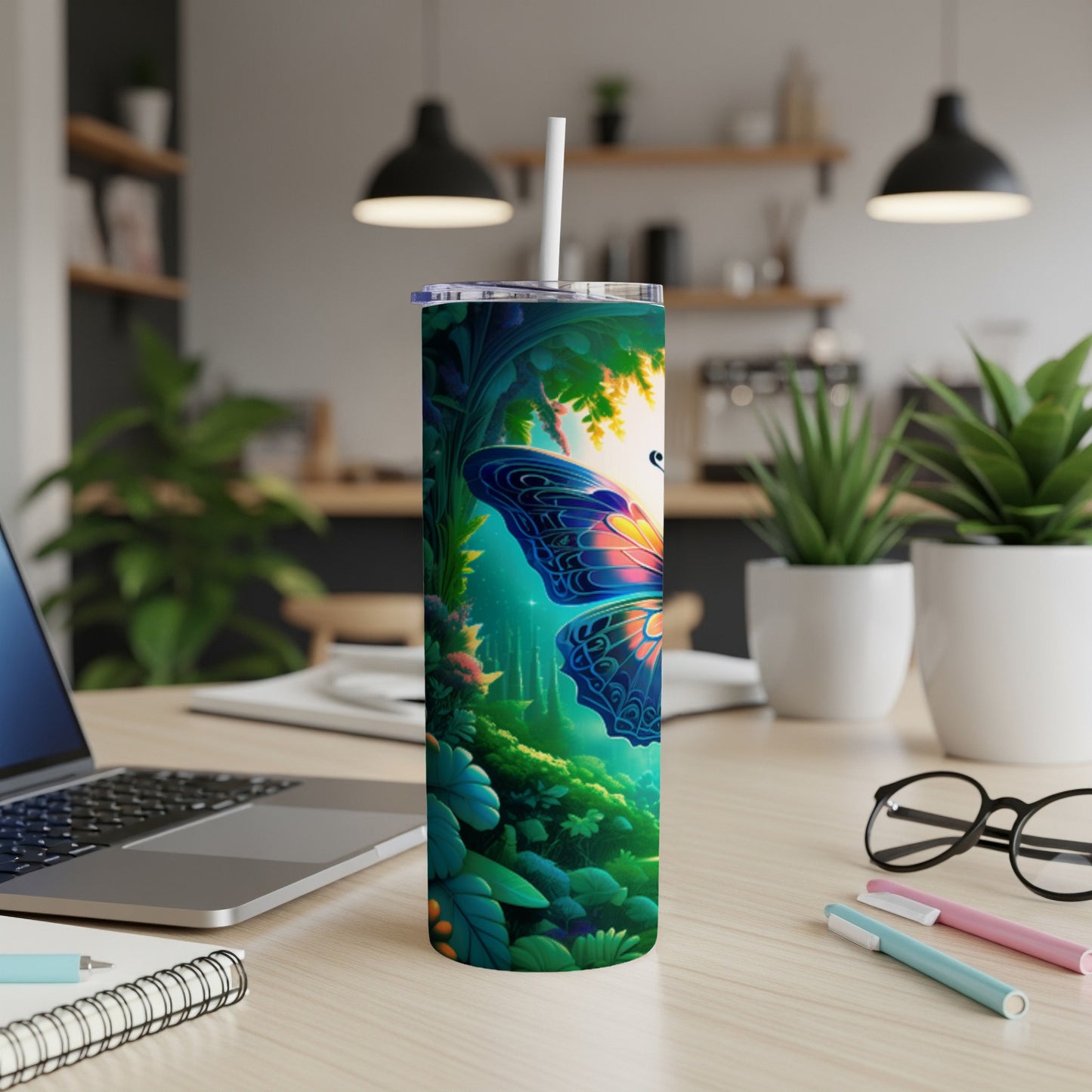 Tall tumbler with a vibrant butterfly and forest design.
