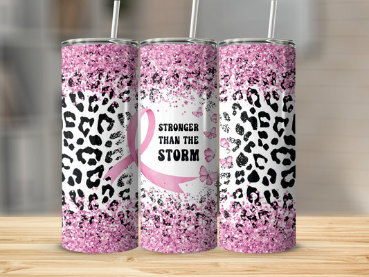 Pink glitter leopard print tumbler with "Stronger Than The Storm" text and ribbon.