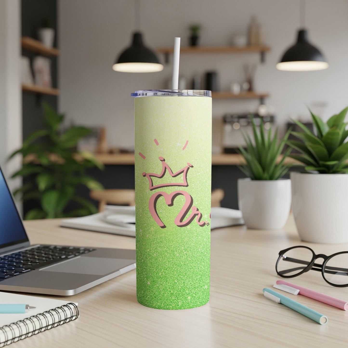 Glittery green tumbler with a pink crown and "2" design.
