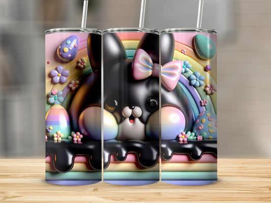 Black bunny with pastel Easter eggs and rainbow on a patterned tumbler.