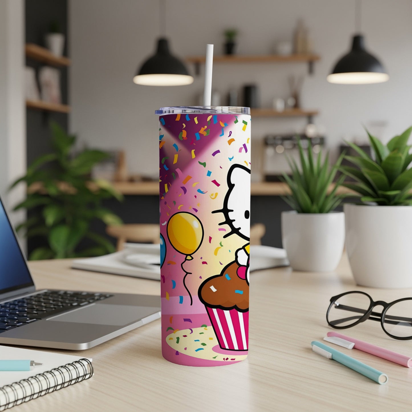 Hello Kitty on a cupcake tumbler with colorful confetti and a balloon.
