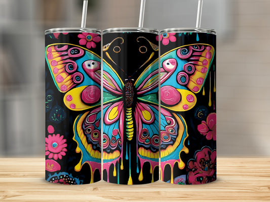 Three tumblers with colorful butterfly and flower designs.