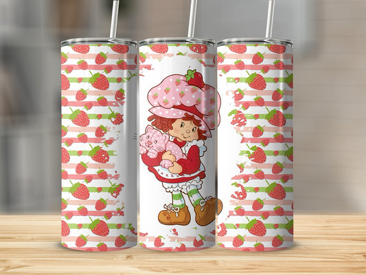 Strawberry Shortcake character holding a pink cat, with strawberry and stripe pattern.
