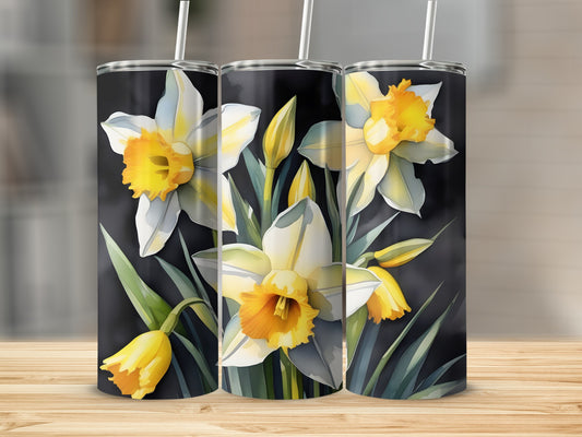 Three tumblers with a watercolor daffodil floral design on a black background.