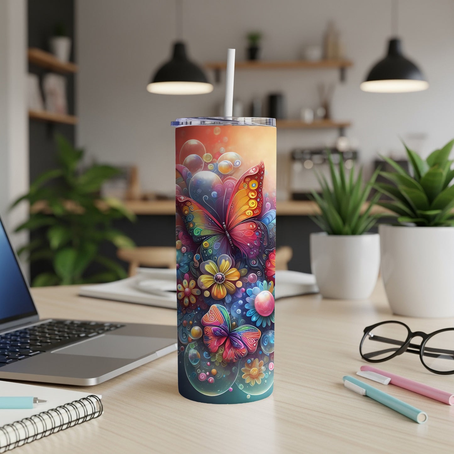 Tumbler with colorful butterflies, flowers, and bubbles design.