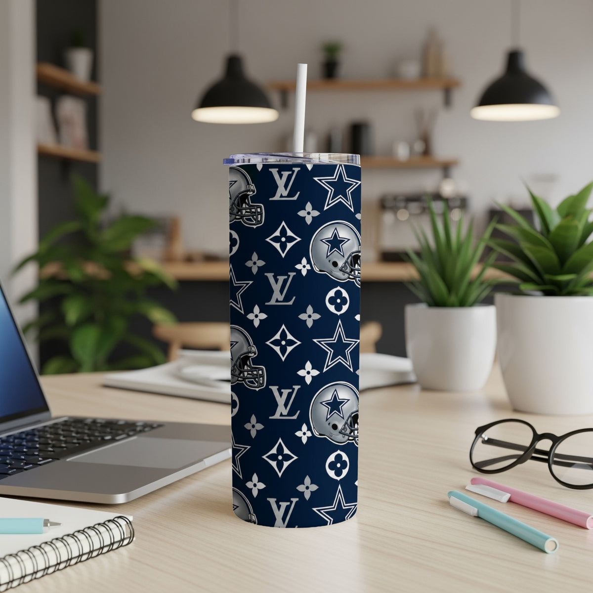 Dallas Cowboys helmet and LV pattern tumbler with a straw.