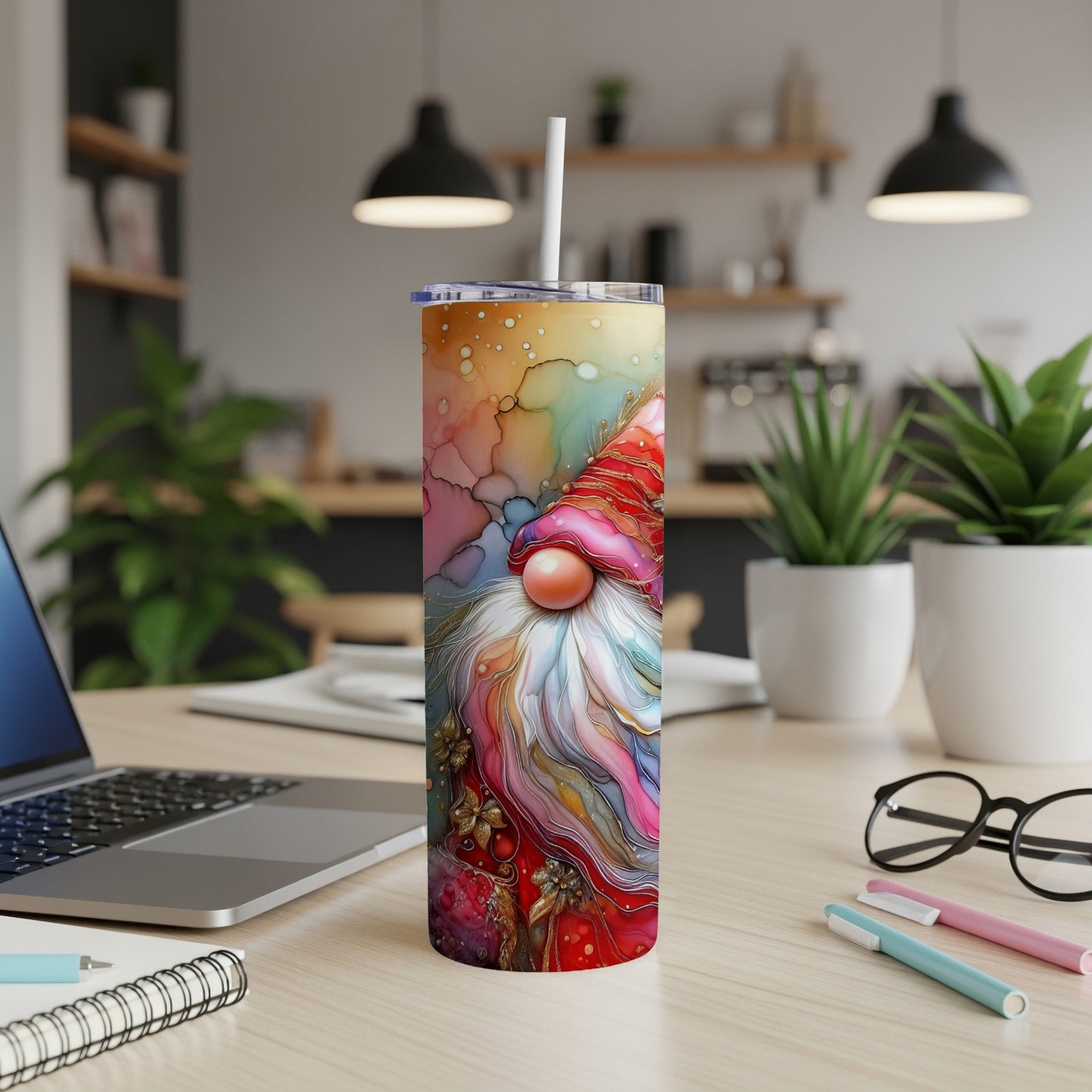 Colorful gnome tumbler with festive holiday accents, on a desk.