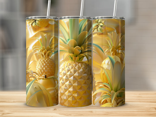 Three golden tumblers with pineapple designs and straws on a wooden surface.