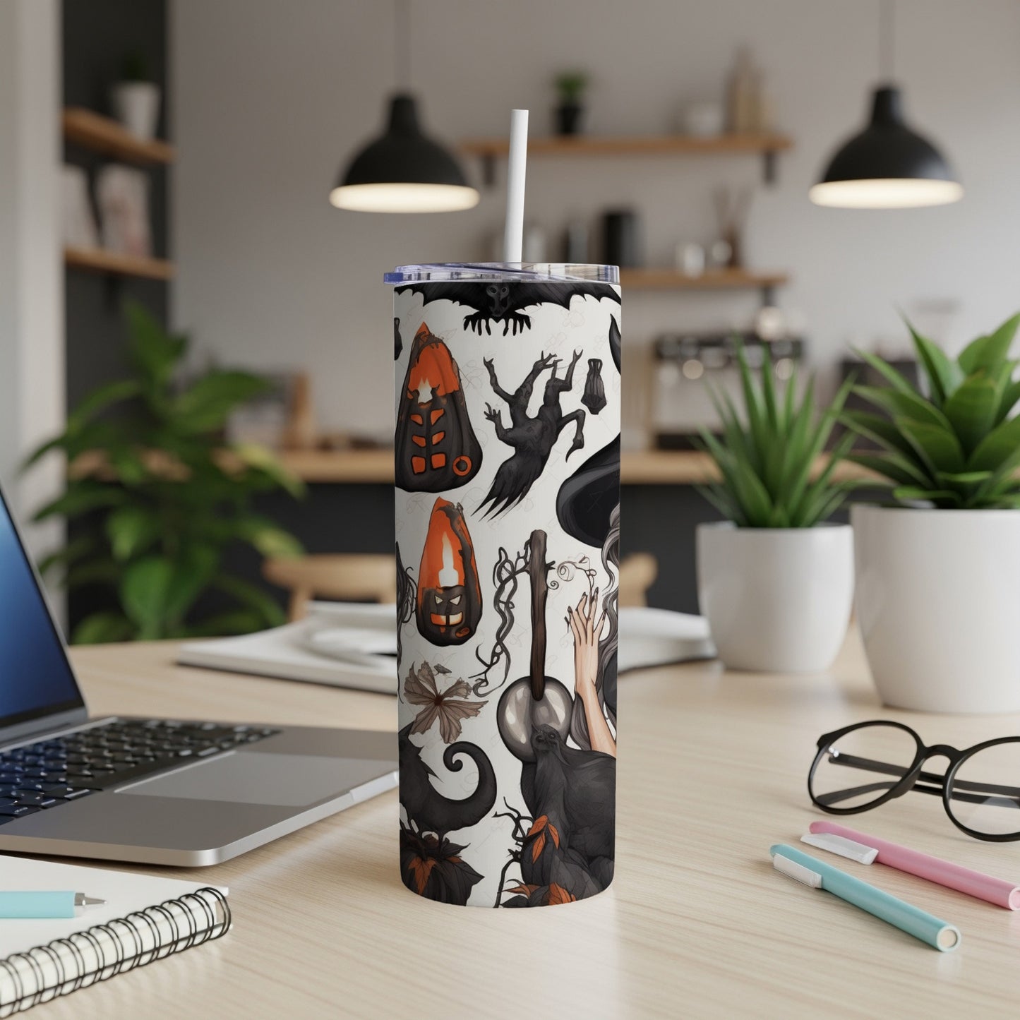 Tumbler with Halloween pattern of bats, ghosts, pumpkins, and witchy elements.