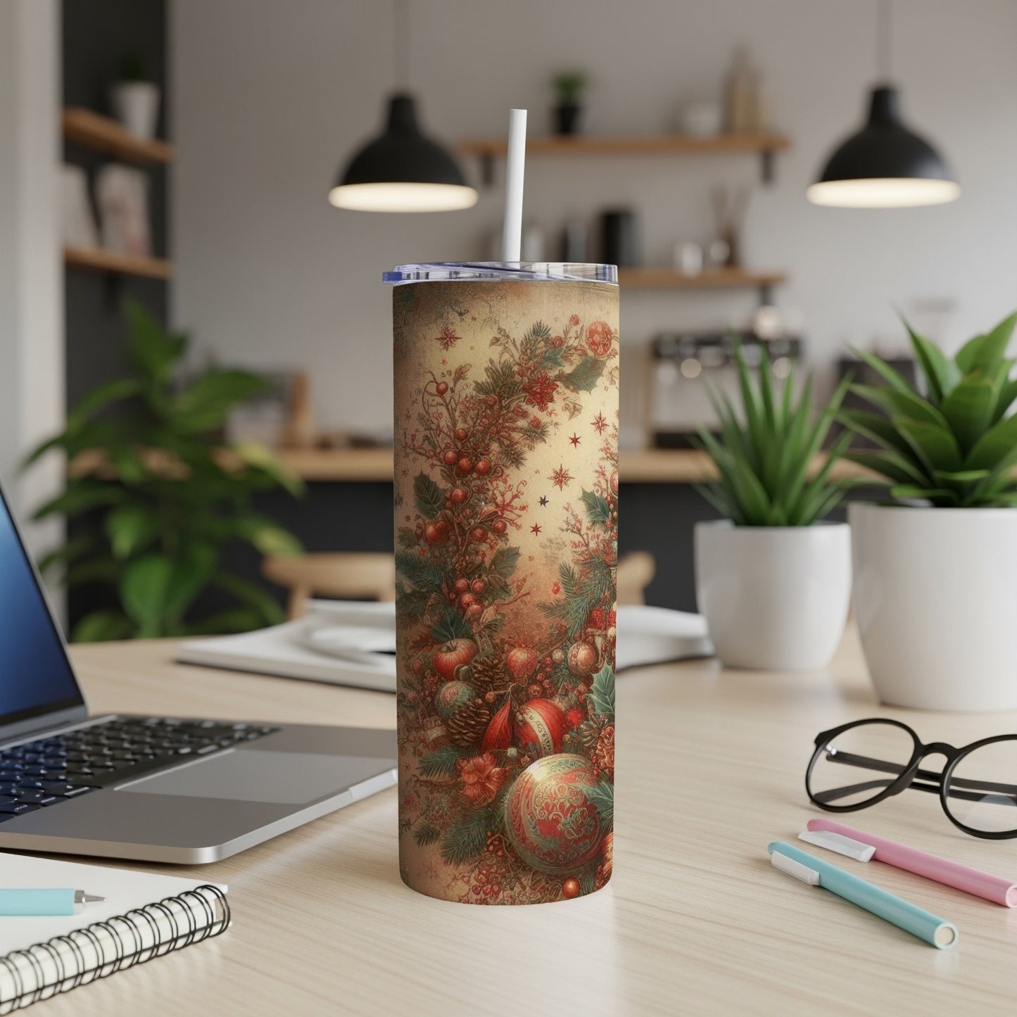Christmas-themed tumbler with festive decorations and a straw.
