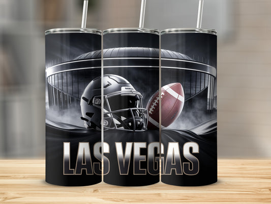 Las Vegas stadium, helmet, and football on a black tumbler.