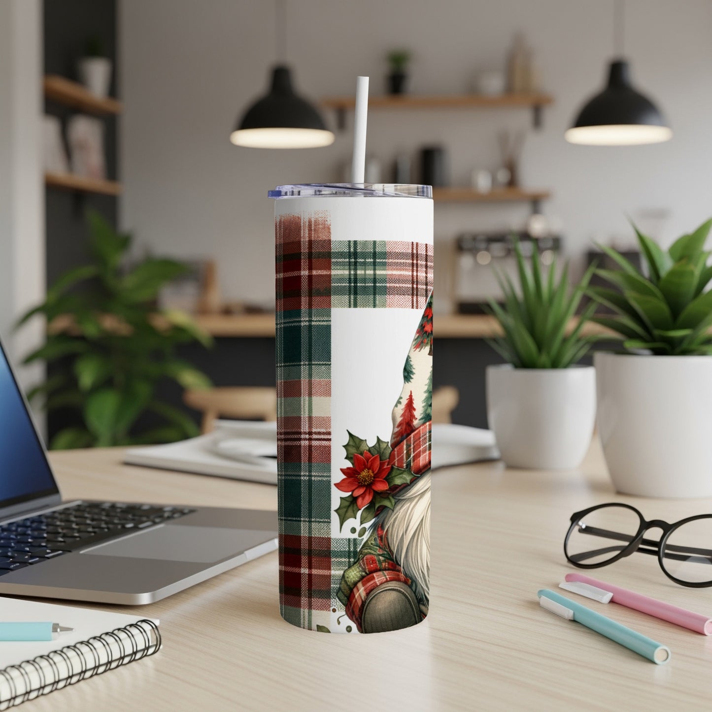 Gnome wearing a plaid hat and Christmas garland on a tumbler.