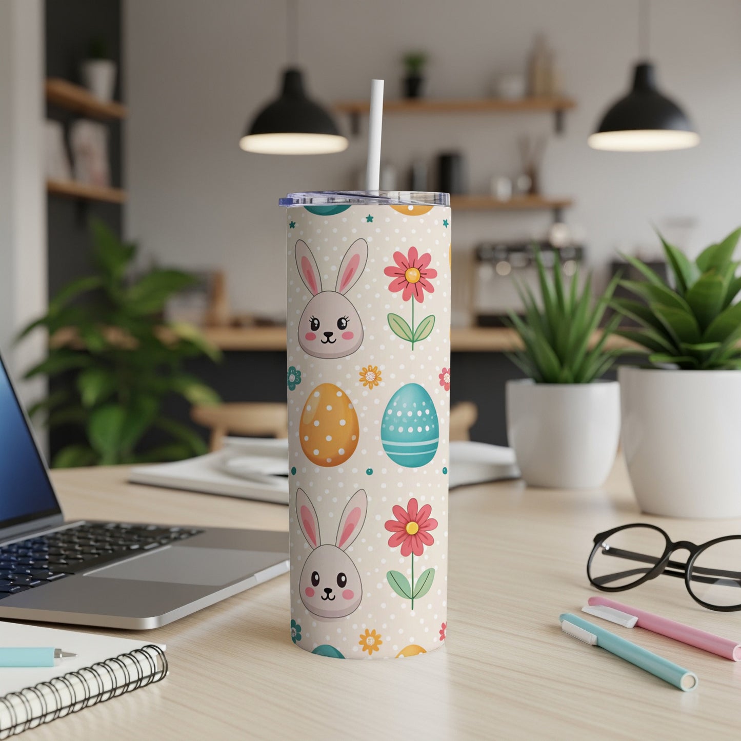 Cream tumbler with scattered Easter eggs, bunnies, and flowers, white straw.