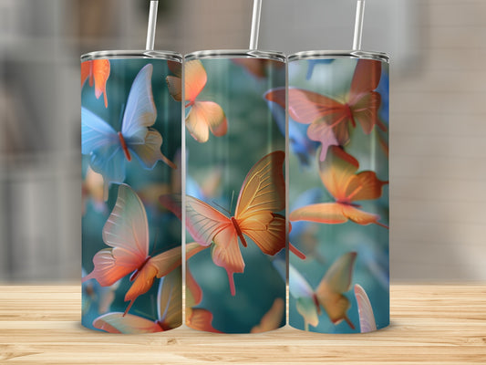 Three tumblers with a translucent butterfly design and straws.