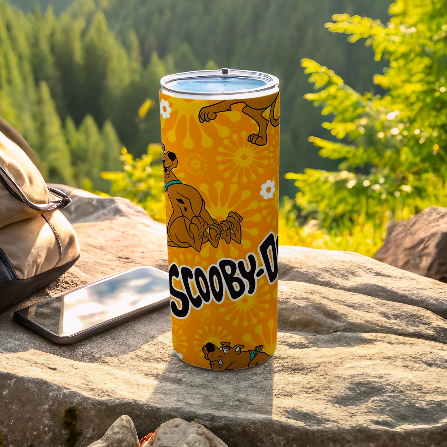 Scooby-Doo tumbler with floral pattern and character graphics.