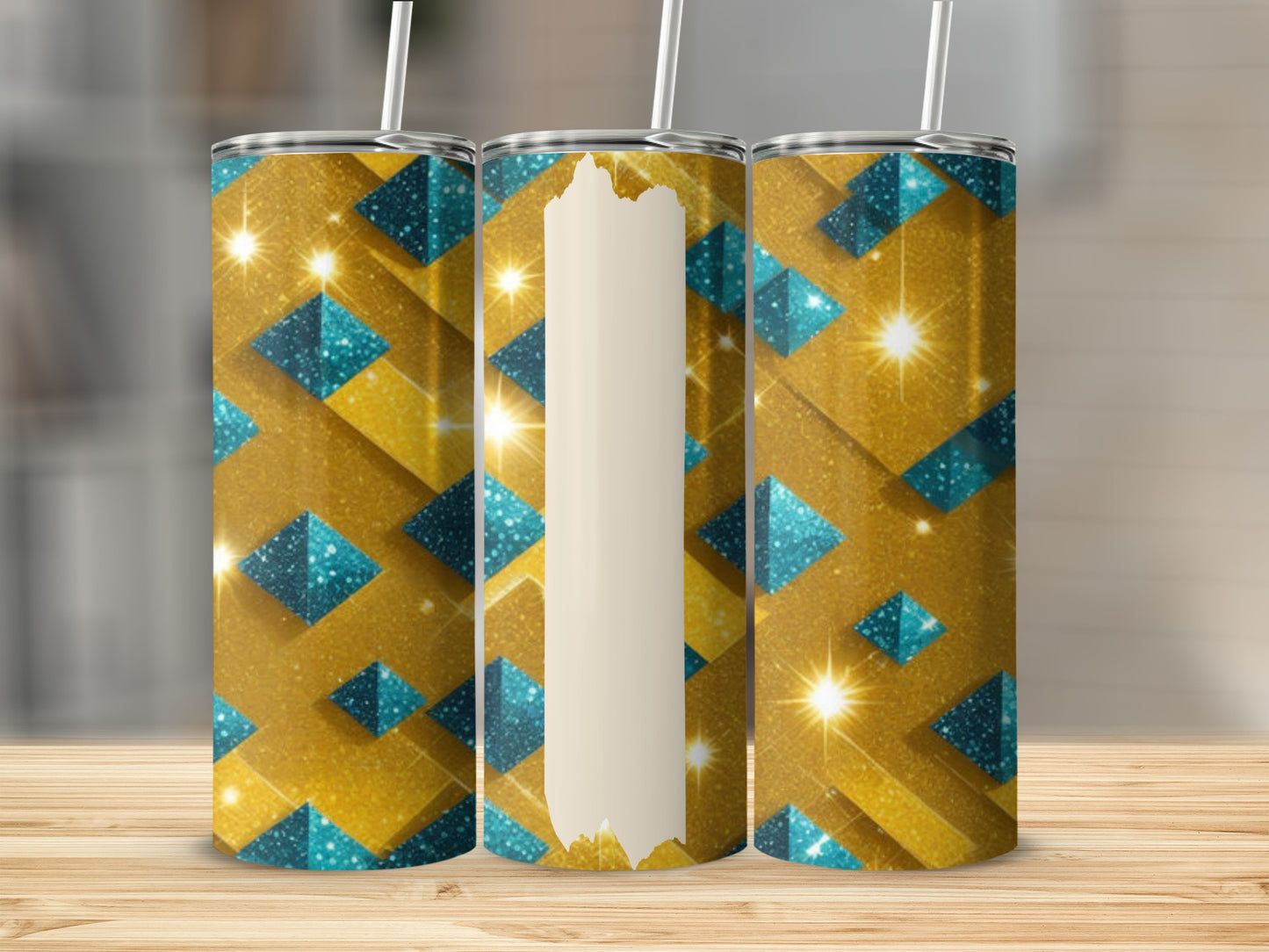 Three tumblers with gold and blue geometric glitter patterns on a wooden surface.