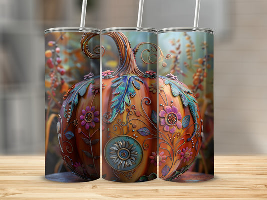 Three decorated pumpkins with straws on a wooden surface.