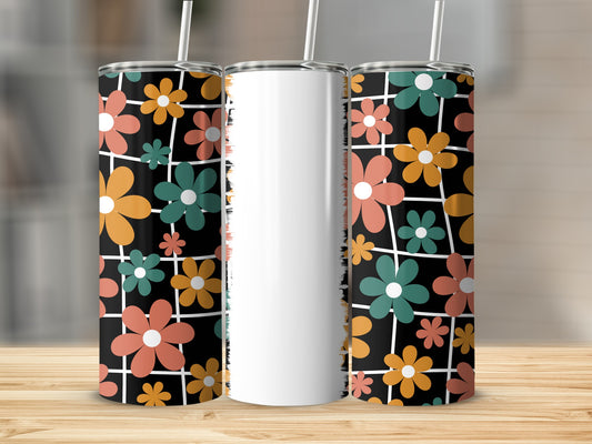 Three tumblers with a retro floral and grid pattern on a wooden surface.