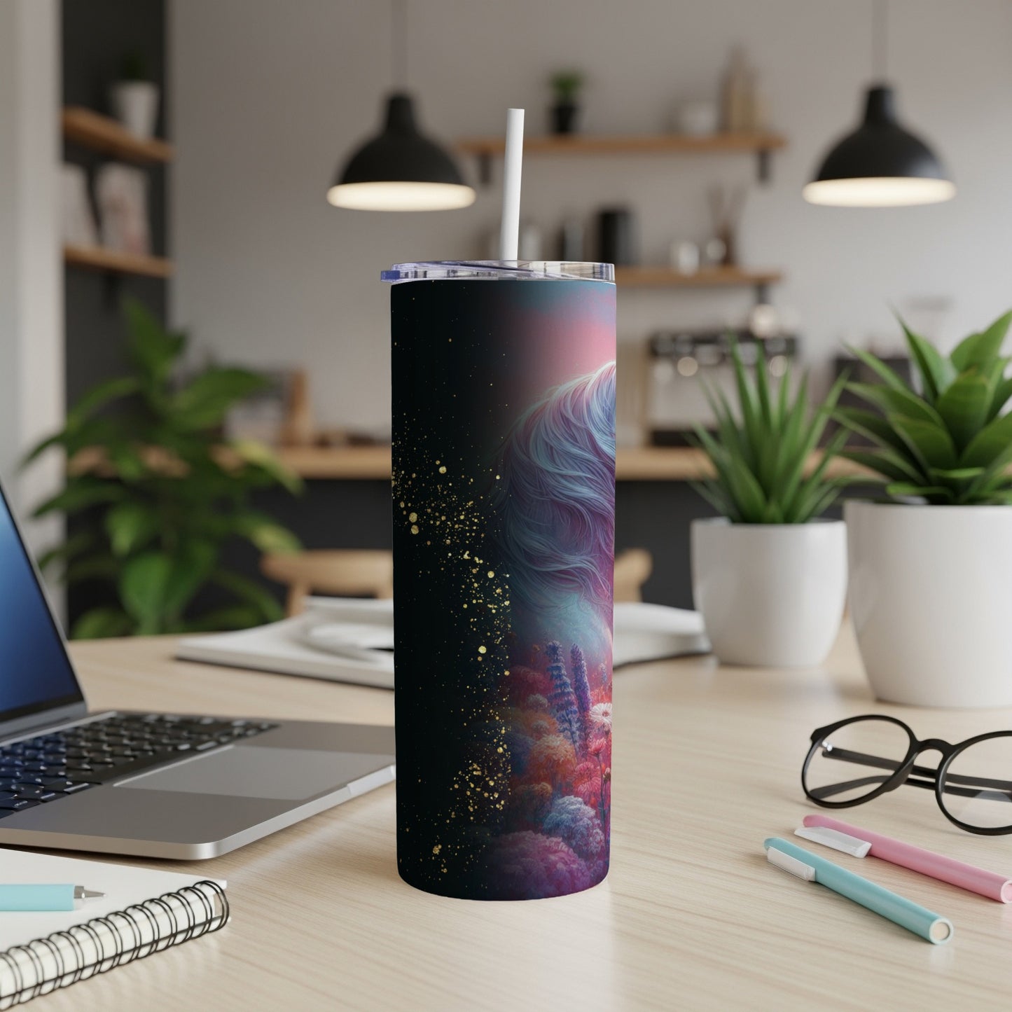 Rainbow unicorn design on a dark tumbler with gold glitter accents.