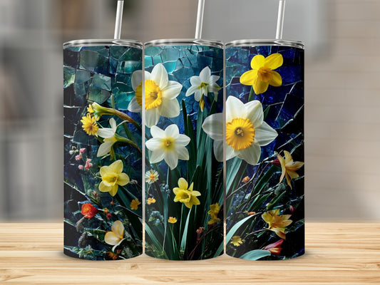 Three tumblers with a floral pattern of yellow and white daffodils and greenery.