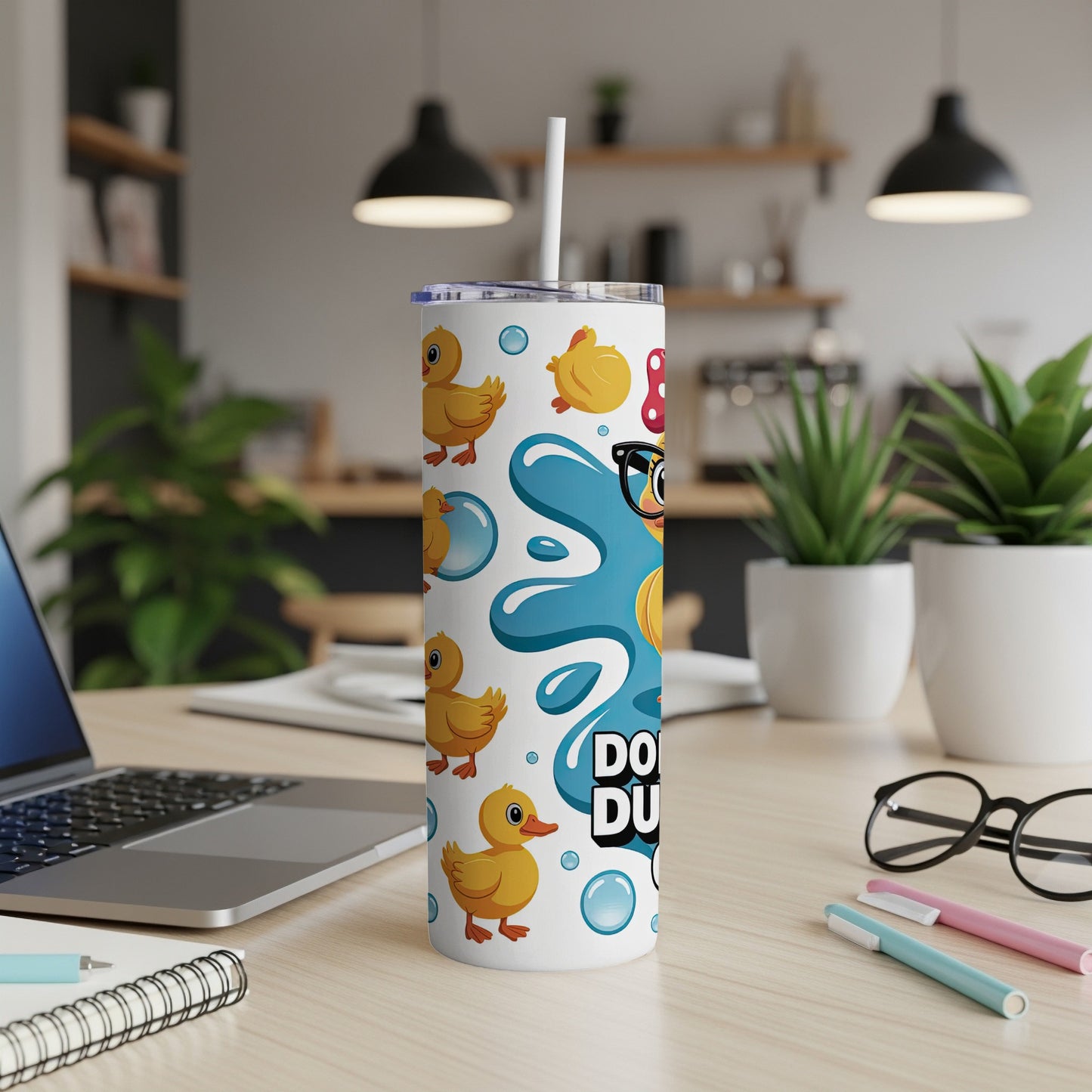 Tumbler with yellow ducklings and bubbles, "Ducky Duck" text.