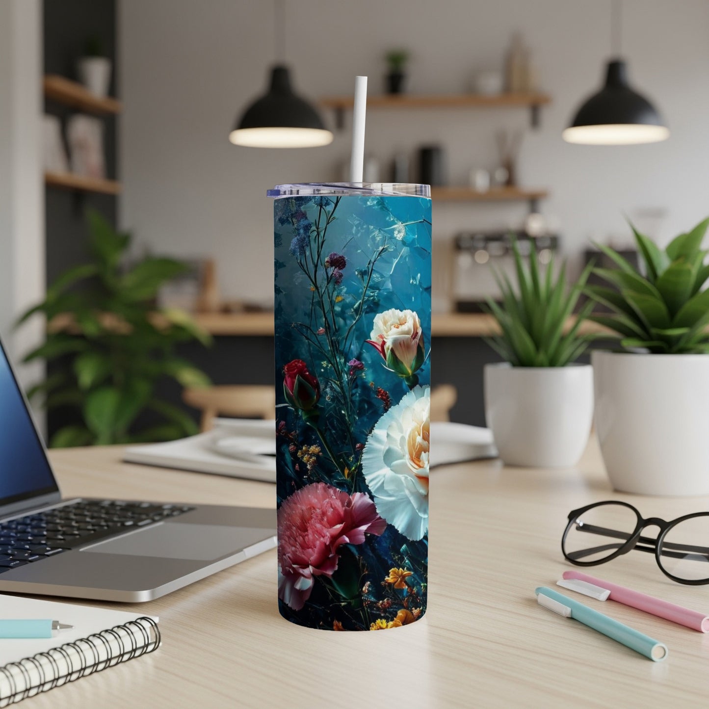 Tall tumbler with a floral design featuring pink and white roses on a dark blue background.