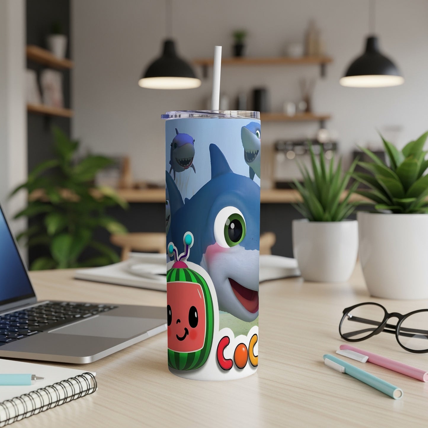 Cocomelon shark design on a white insulated tumbler with a straw.