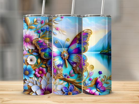 Three tall tumblers with vibrant butterfly and floral designs on a wooden surface.